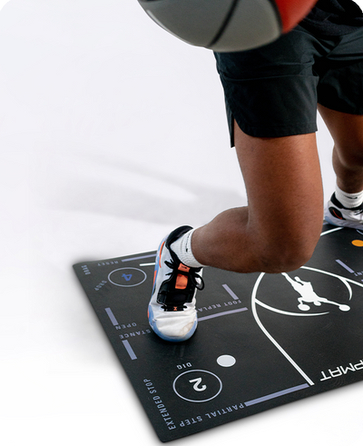 Basketball player performing footwork drill on numbered DrillMat